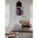 Kitchen island with large basin sink and granite countertops at Church + State Apartments