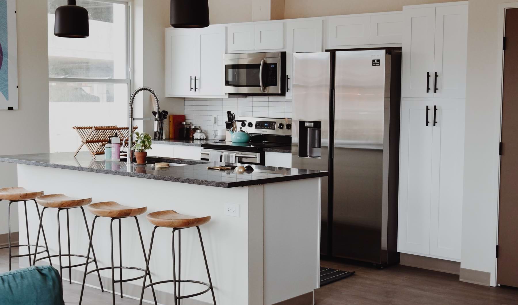 Kitchen island and modern appliances - Church + State Apartments